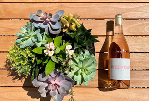 Bottle of weekday wines with a spring flower